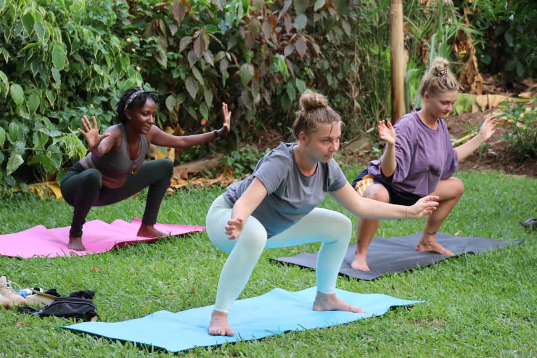 Post-Natal Yoga class with supported squats in Entebbe